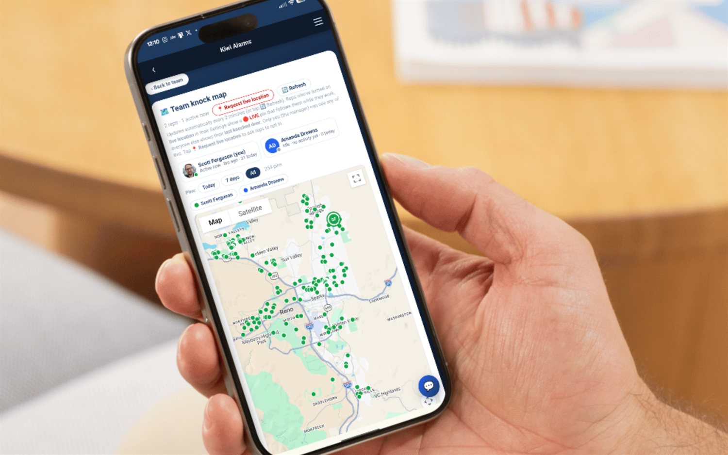 SecurityQS team knock map on a phone — every rep's GPS-verified knocks as live pins across the territory, with a roster showing who's active now